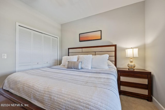 carpeted bedroom featuring a closet