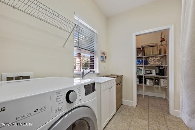 laundry area featuring cabinets, washer hookup, and sink