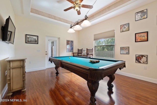 playroom featuring dark hardwood / wood-style flooring, a raised ceiling, ceiling fan, and billiards