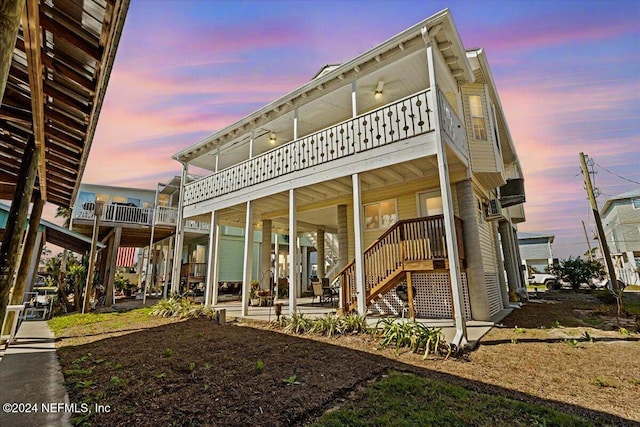 back house at dusk with ceiling fan