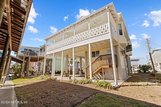 back of house featuring ceiling fan