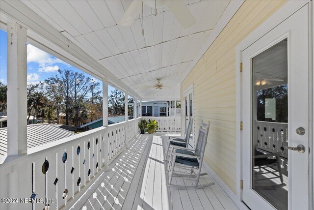 wooden deck with ceiling fan