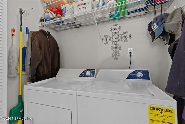 clothes washing area featuring washing machine and dryer