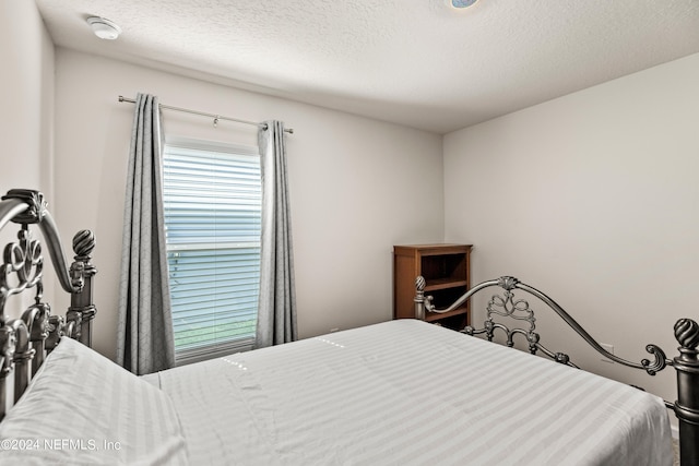 bedroom featuring a textured ceiling