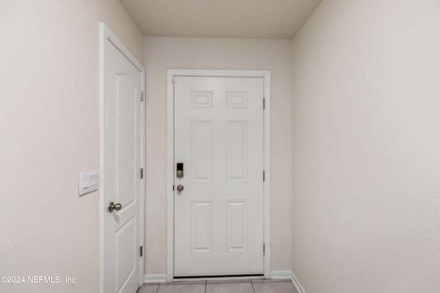 doorway featuring light tile patterned floors