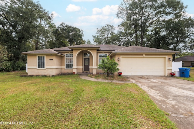 view of front of property with a front lawn and a garage