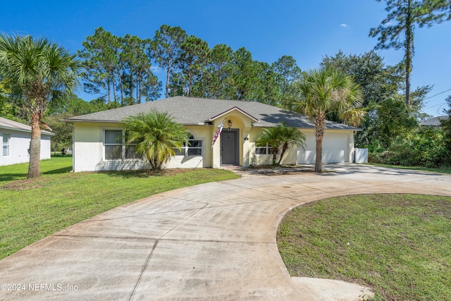 single story home with a front yard and a garage