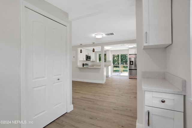 hallway featuring light hardwood / wood-style flooring