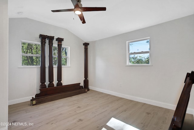 unfurnished room with ceiling fan, light hardwood / wood-style floors, and lofted ceiling