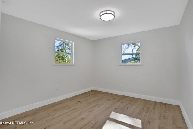 unfurnished room with light hardwood / wood-style flooring