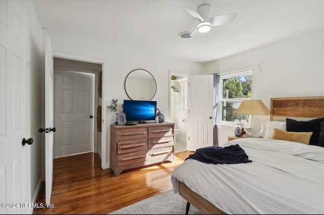 bedroom with hardwood / wood-style flooring and ceiling fan