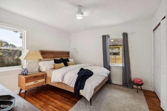 bedroom featuring hardwood / wood-style floors, a closet, and ceiling fan