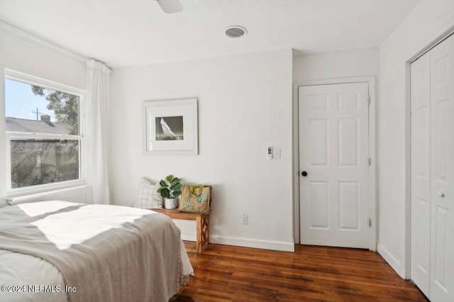 bedroom with ceiling fan and dark hardwood / wood-style flooring