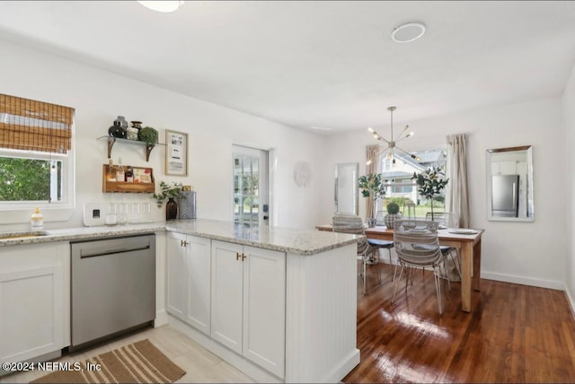 kitchen featuring kitchen peninsula, light wood-type flooring, white cabinetry, and stainless steel dishwasher