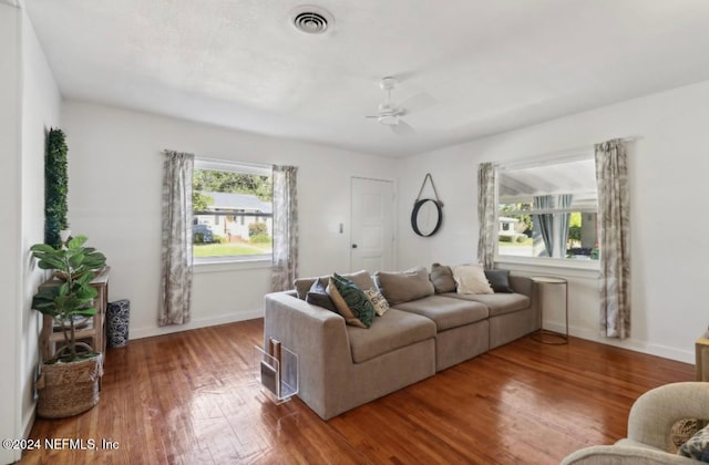 living room with hardwood / wood-style floors and ceiling fan