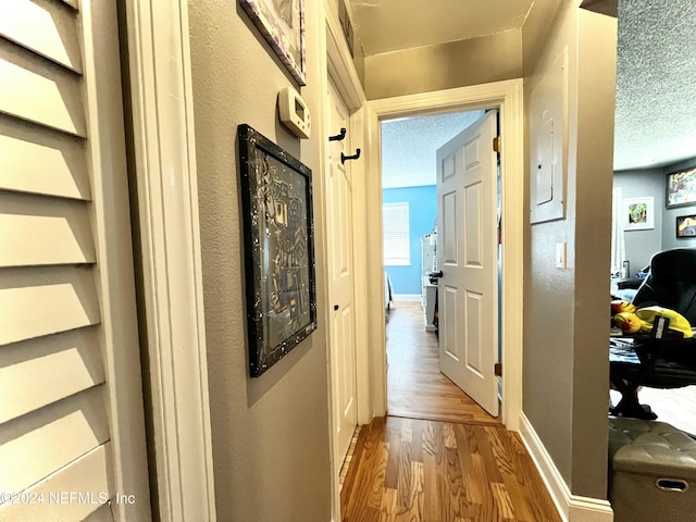 650 Pope Rd W Unit 251, Saint Augustine, FL 32080 - hallway featuring wood finished floors and baseboards