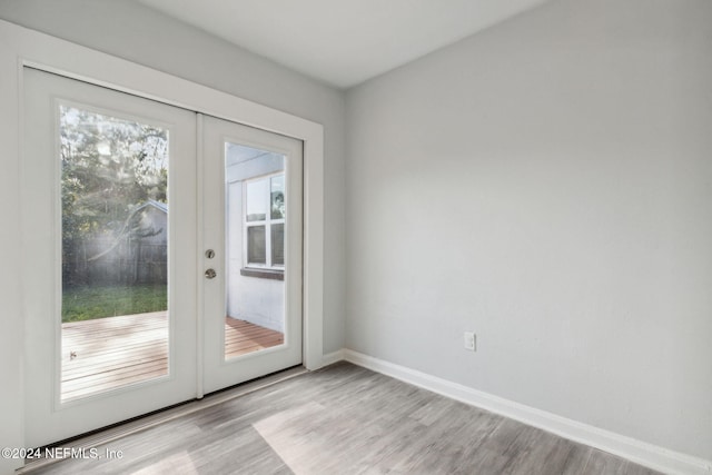 entryway with french doors and light wood-type flooring