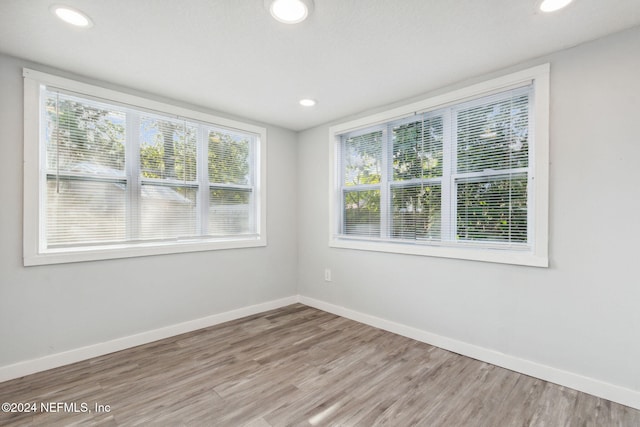 spare room featuring light hardwood / wood-style flooring