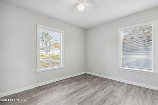 spare room featuring ceiling fan and light hardwood / wood-style floors