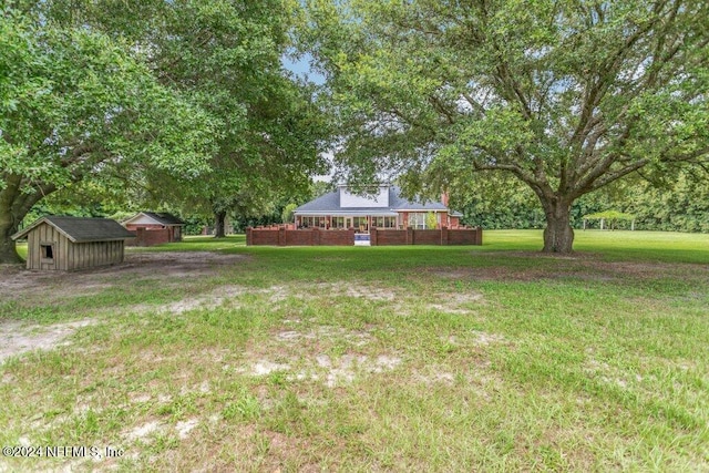 7436 Woodlawn Rd, Macclenny, FL 32063 - view of yard featuring a storage shed