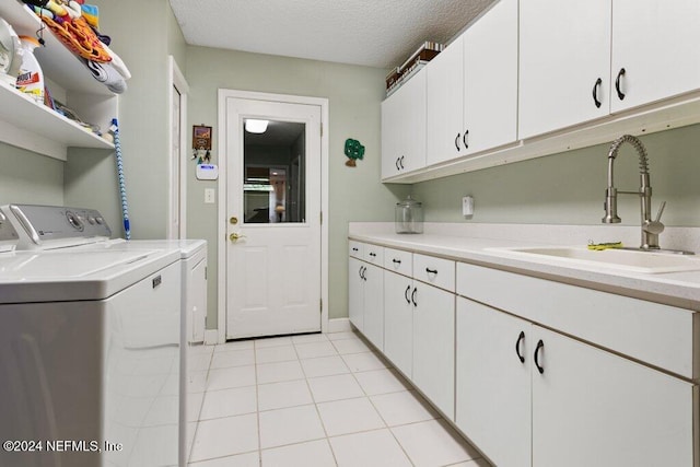 7436 Woodlawn Rd, Macclenny, FL 32063 - clothes washing area featuring cabinets, sink, independent washer and dryer, a textured ceiling, and light tile patterned floors