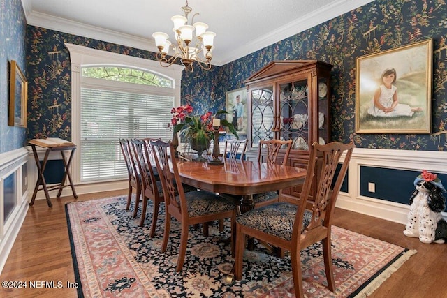 7436 Woodlawn Rd, Macclenny, FL 32063 - dining space with ornamental molding, a chandelier, and wood-type flooring