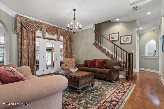 7436 Woodlawn Rd, Macclenny, FL 32063 - living room with a chandelier, wood-type flooring, and ornamental molding