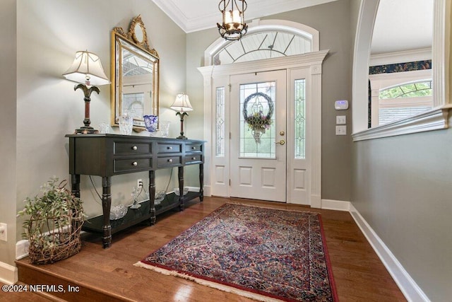 7436 Woodlawn Rd, Macclenny, FL 32063 - entrance foyer featuring a healthy amount of sunlight, crown molding, and dark wood-type flooring