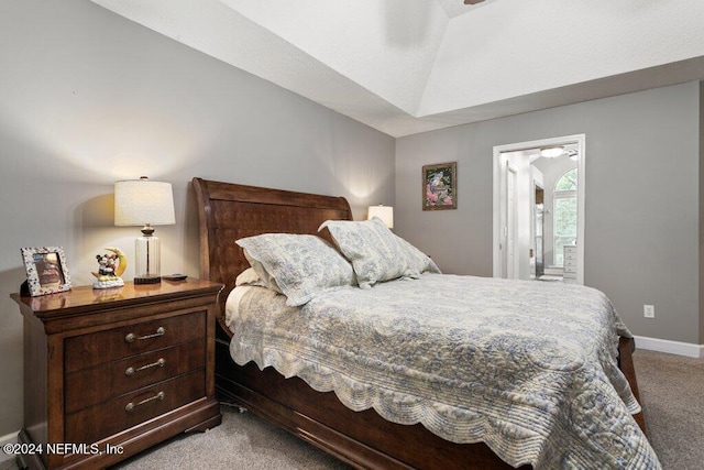 7436 Woodlawn Rd, Macclenny, FL 32063 - bedroom with connected bathroom, light colored carpet, and vaulted ceiling
