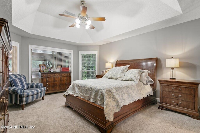 7436 Woodlawn Rd, Macclenny, FL 32063 - bedroom featuring light carpet, a raised ceiling, and ceiling fan