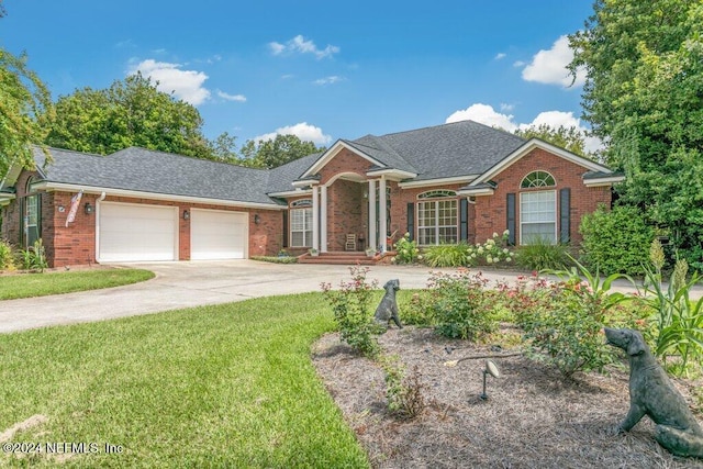 7436 Woodlawn Rd, Macclenny, FL 32063 - view of front of house with a garage and a front yard