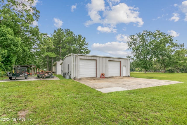 7436 Woodlawn Rd, Macclenny, FL 32063 - garage featuring a yard and a carport