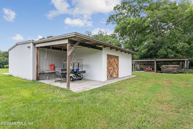 7436 Woodlawn Rd, Macclenny, FL 32063 - view of outdoor structure featuring a lawn