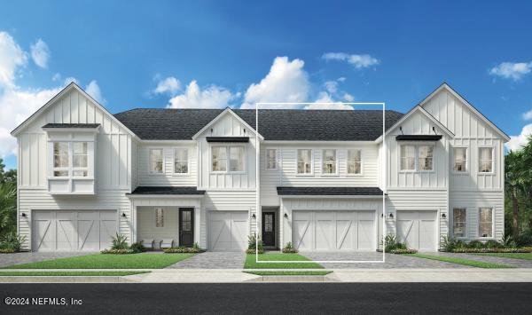 71 Delwood Way Unit 216, Saint Augustine, FL 32092 - view of front of house with board and batten siding, a garage, and driveway