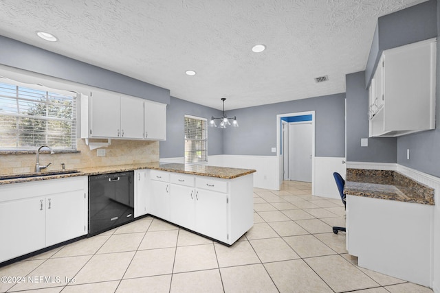 kitchen featuring kitchen peninsula, black dishwasher, white cabinetry, and sink