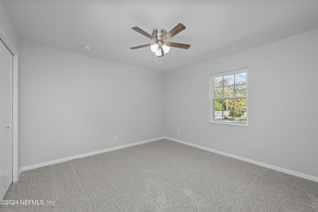 unfurnished room featuring carpet flooring and ceiling fan