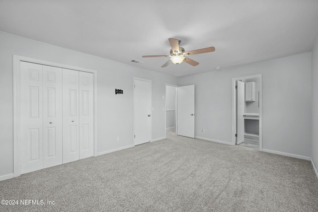 unfurnished bedroom with light carpet and ceiling fan