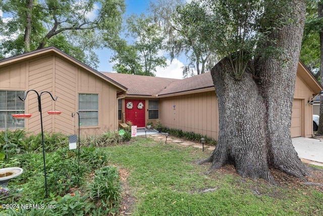 ranch-style home with a garage