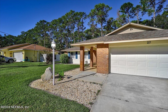 ranch-style home with a garage and a front yard