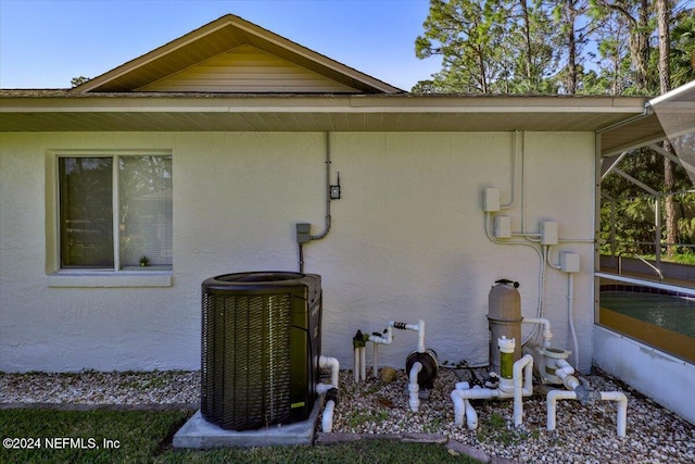 view of property exterior with cooling unit