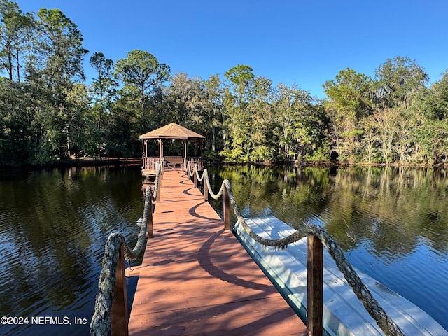 dock area featuring a gazebo and a water view