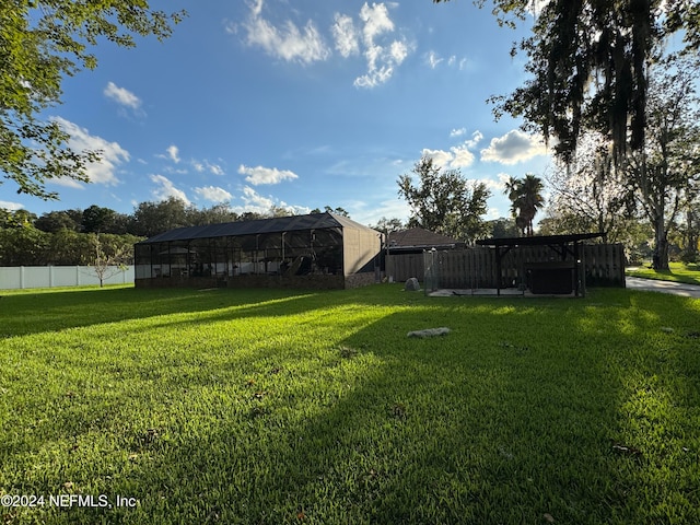 view of yard with a lanai