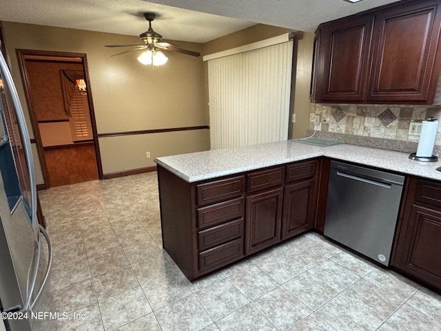 kitchen with ceiling fan, stainless steel dishwasher, backsplash, kitchen peninsula, and refrigerator