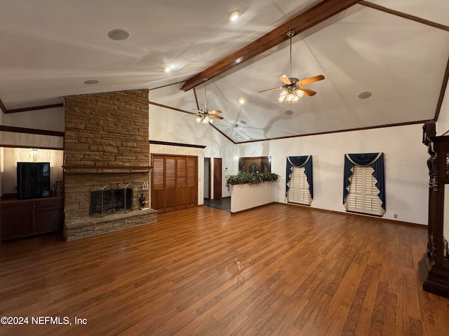 unfurnished living room with hardwood / wood-style flooring, beam ceiling, a fireplace, and high vaulted ceiling