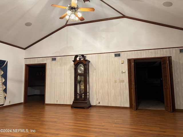 unfurnished living room with ceiling fan, dark hardwood / wood-style flooring, and high vaulted ceiling