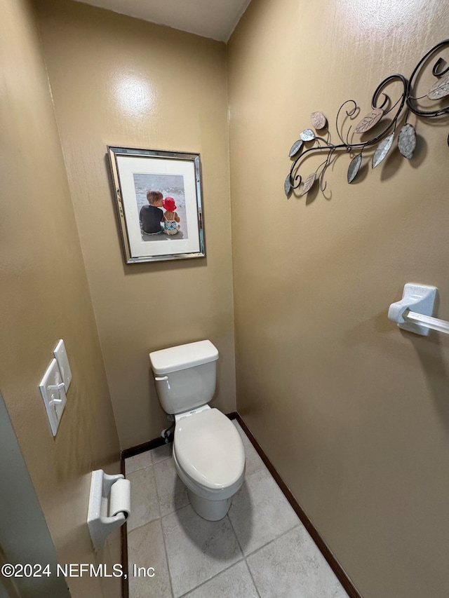 bathroom featuring tile patterned floors and toilet