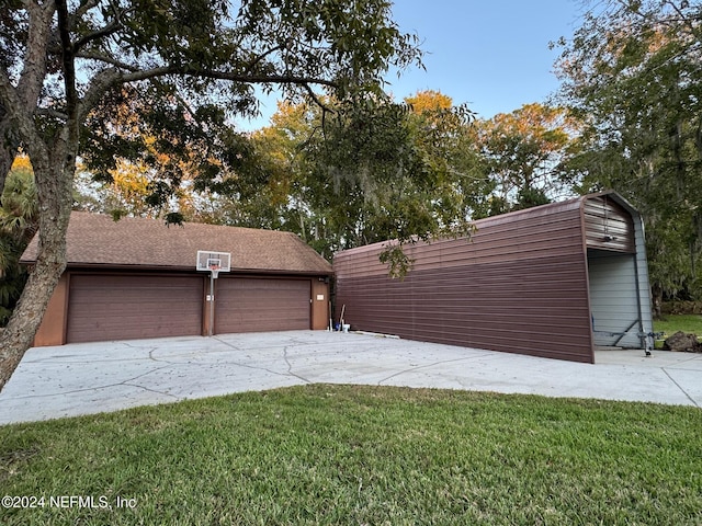 garage featuring a yard