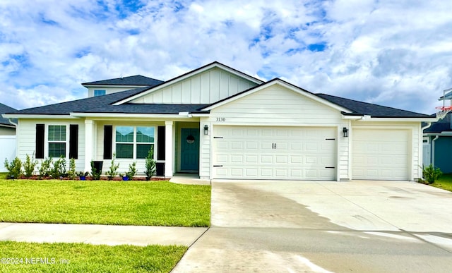 view of front facade featuring a garage and a front lawn