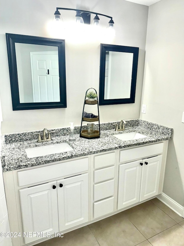 bathroom featuring tile patterned floors and vanity