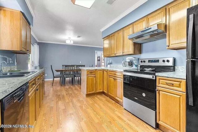 kitchen featuring kitchen peninsula, light wood-type flooring, ornamental molding, sink, and black appliances